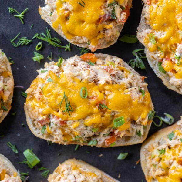 Tuna melts with herbs next to it.