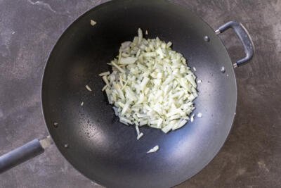 Onions in a wok.