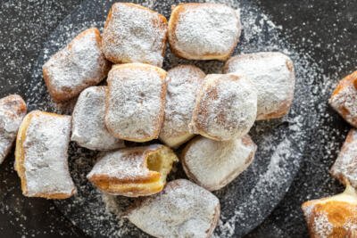 Beignets on a serving tray.