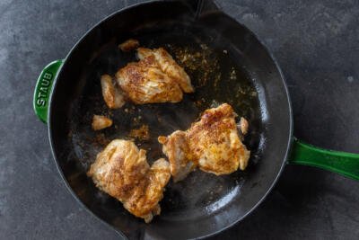 Chicken on a frying pan.