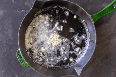 Butter with garlic in a pan.