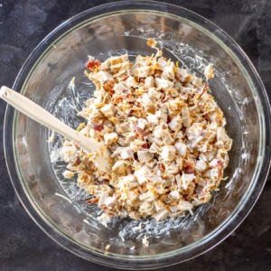 Chicken, bacon, ranch and cheese in a bowl.