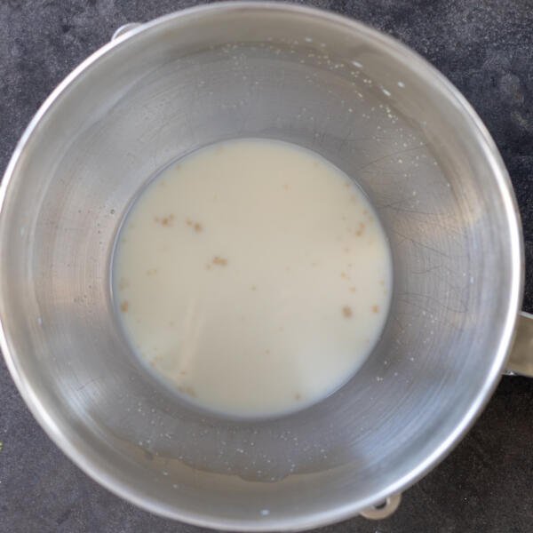 Liquids and yeast, sugar and salt ina. mixing bowl.