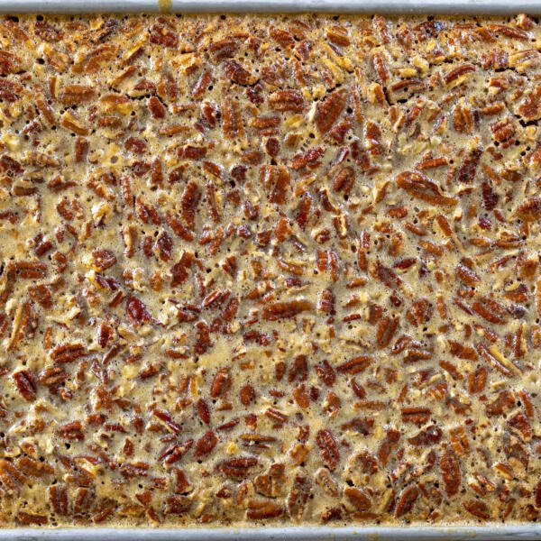 Baked Pecan Pie Bars in a baking sheet.