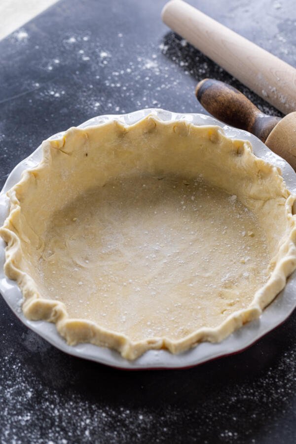 Pie crust dough in a pan.