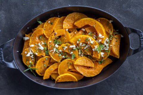 Roasted Butternut Squash in a pan with garlic.