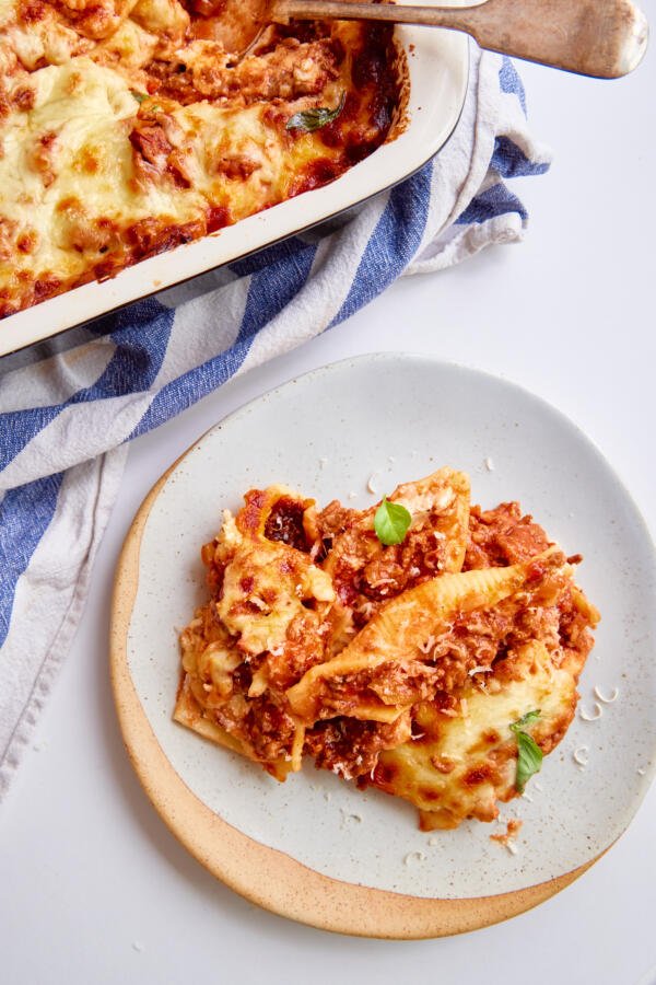 Plate with a dish of Stuffed Shells with Meat Sauce.