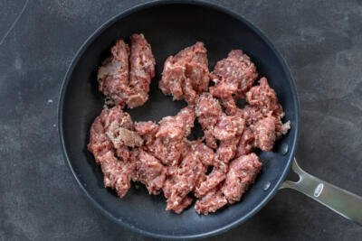 Meat browning in a pan.