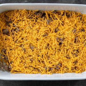Meat and cheese in a dish.
