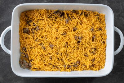 Meat and cheese in a dish.