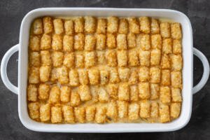 Tater Tot Breakfast Casserole before baking in a dish.