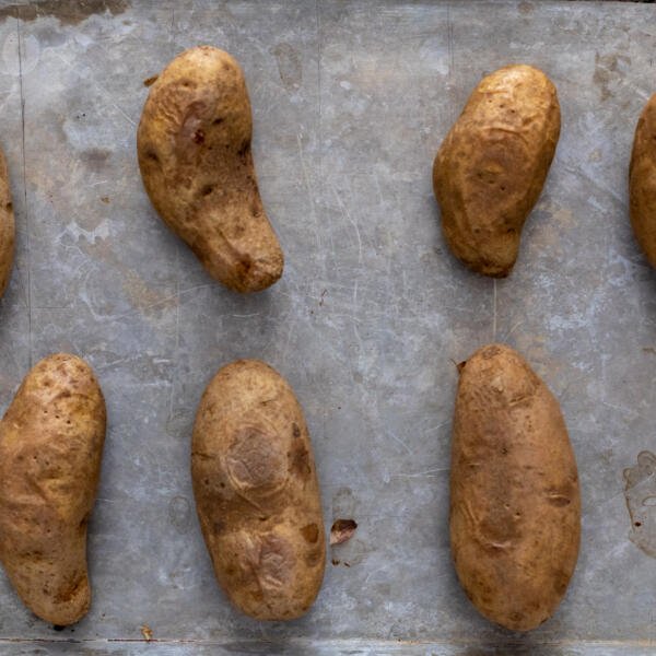 Baked potatoes on a baking sheet.