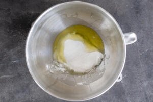 Egg whiles with sugar in a bowl.
