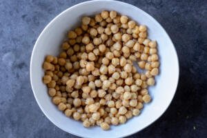 Chickpeas in a bowl with seasoning.