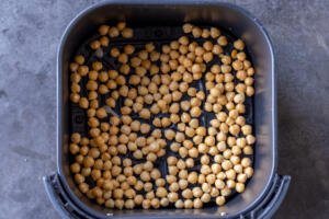 Chickpeas in Air Fryer basket.