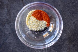 Garlic parsley salt and paprika in a bowl.