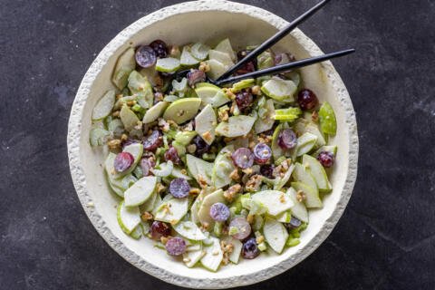 Waldorf Salad with dressing in a serving dish.