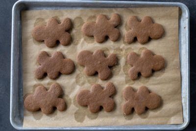 Baked Gingerbread Cookie on a baking sheet.