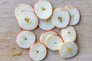 Sliced apples on a cutting board.