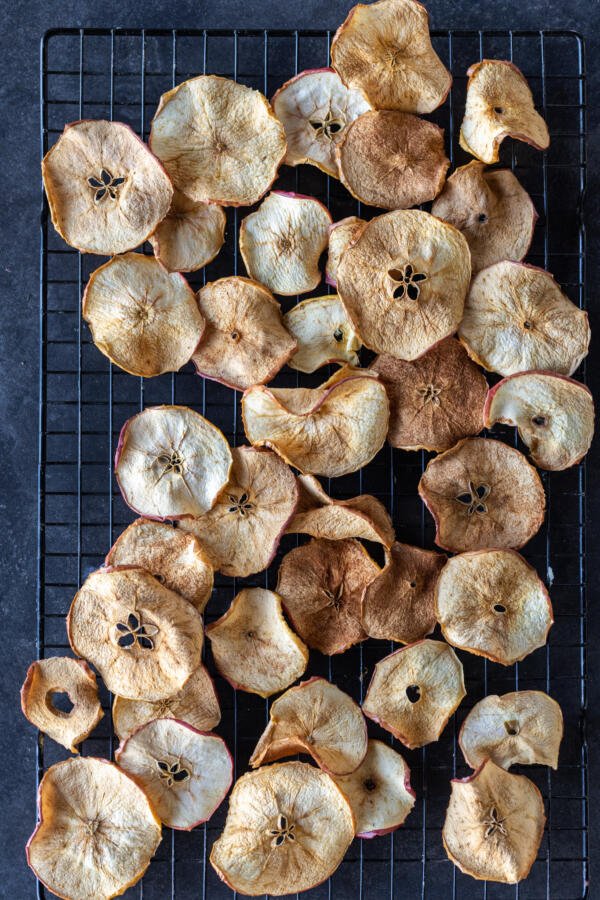 Crispy apple chips on a cooling rack. 