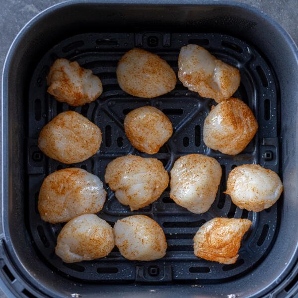 Air fryer basket with Scallops.