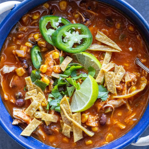 Chicken Tortilla Soup with topping in a bowl.