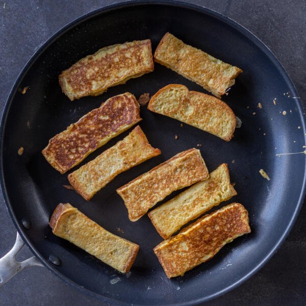 Toast sticks in a frying pan.
