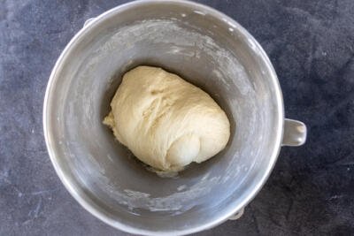 Kneaded dough in a mixing bowl.