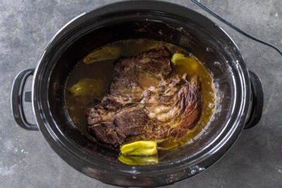 Cooked Mississippi Pot Roast in a slow cooker.
