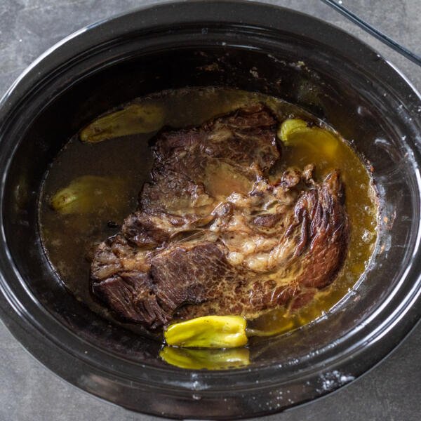 Cooked Mississippi Pot Roast in a slow cooker.
