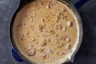 Creamy mushroom sauce in a pan.