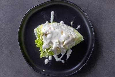 Ranch added to lettuce.