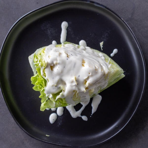 Ranch added to lettuce.