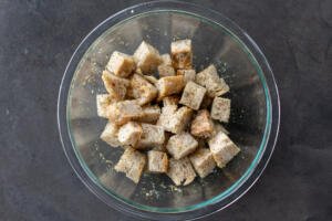 Seasoned bread in a bowl.