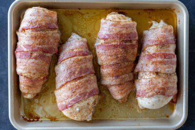 Baked Bacon Wrapped Chicken Breasts in a pan.