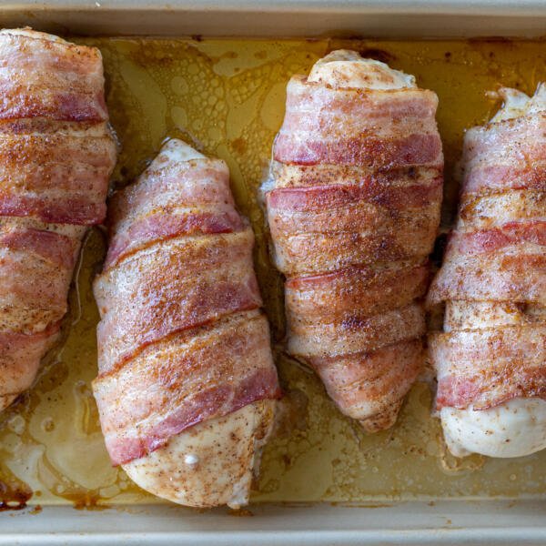Baked Bacon Wrapped Chicken Breasts in a pan.