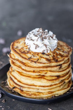 Chocolate chip pancakes on top of each other.
