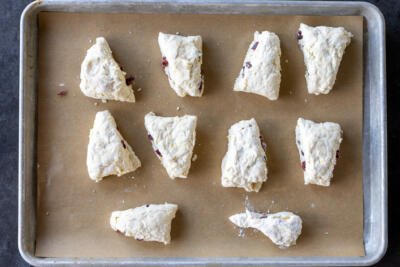 Scones cut into pieces on a baking sheet.