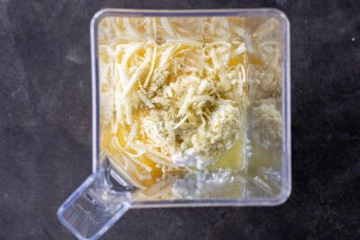 Eggs, seasoning and cheese in a blender.