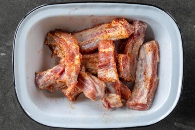 Seasoned pork ribs in a bowl.