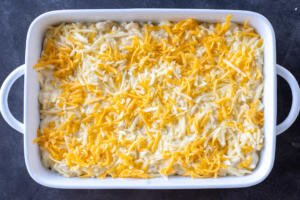 Mac and Cheese in a baking dish with cheese on top.