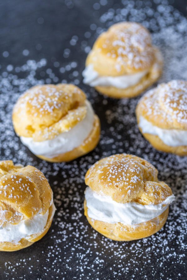 Cut open Cream Puffs with a filling.
