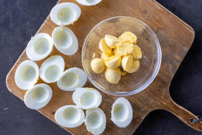 Eggs cut open with yolks removed.