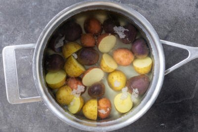 Potatoes boiling in a pot.