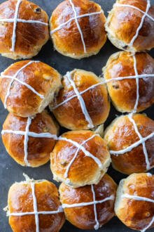 Soft Hot Cross Buns on a baking sheet.