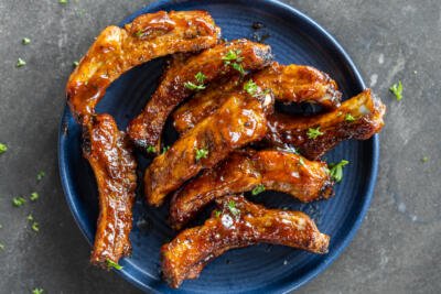 Plated Air Fryer Ribs with herbs.