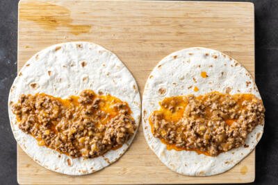 Flour tortillas with ground beef enchilada sauce.