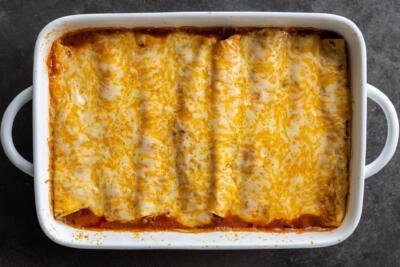 Baked Ground Beef Enchiladas in a baking pan.