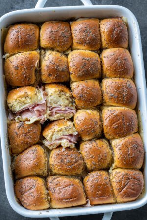 Baked Ham and Cheese Sliders in a pan.