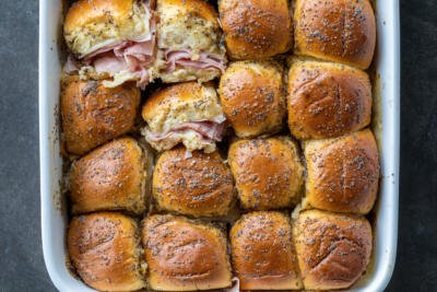 Baked Ham and Cheese Sliders with a few pulled out.